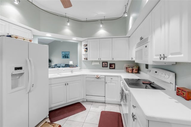 7637 Sweetbay Cir, Bradenton, FL 34203 - kitchen featuring white appliances, a sink, light tile patterned floors, light countertops, and white cabinetry