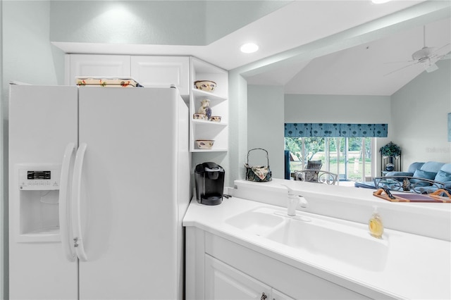 7637 Sweetbay Cir, Bradenton, FL 34203 - kitchen with white refrigerator with ice dispenser, white cabinets, ceiling fan, a sink, and recessed lighting