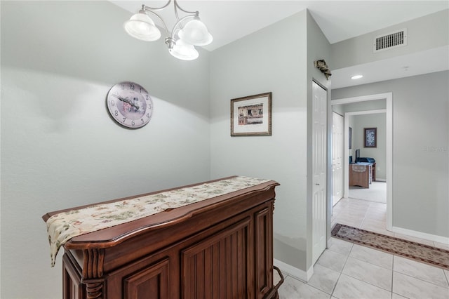 7637 Sweetbay Cir, Bradenton, FL 34203 - hall featuring a chandelier, baseboards, and light tile patterned floors