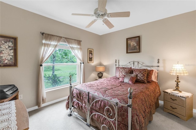 7637 Sweetbay Cir, Bradenton, FL 34203 - bedroom with light colored carpet, baseboards, multiple windows, and ceiling fan