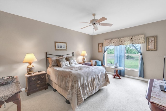 7637 Sweetbay Cir, Bradenton, FL 34203 - bedroom with light carpet, baseboards, and a ceiling fan