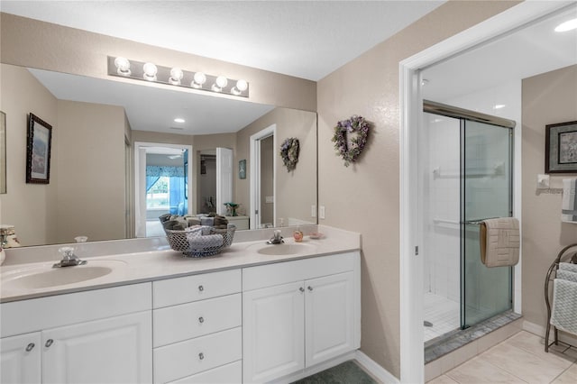 7637 Sweetbay Cir, Bradenton, FL 34203 - full bathroom featuring a shower stall, double vanity, and baseboards