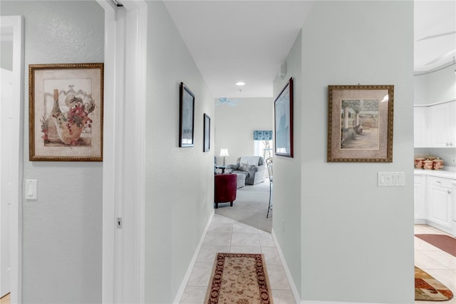 7637 Sweetbay Cir, Bradenton, FL 34203 - corridor featuring light tile patterned flooring and baseboards