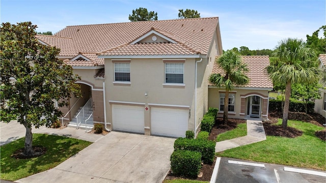 7637 Sweetbay Cir, Bradenton, FL 34203 - view of front facade featuring a tile roof, stucco siding, concrete driveway, and a garage