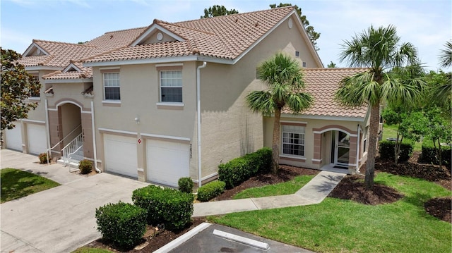 7637 Sweetbay Cir, Bradenton, FL 34203 - mediterranean / spanish-style home featuring a tile roof, stucco siding, a garage, and concrete driveway