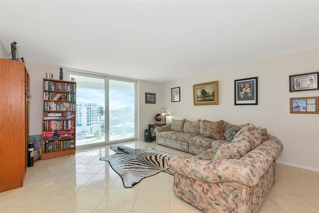 101 S Gulfstream Ave Unit 16C, Sarasota, FL 34236 - tiled living room with expansive windows, a barn door, and baseboards