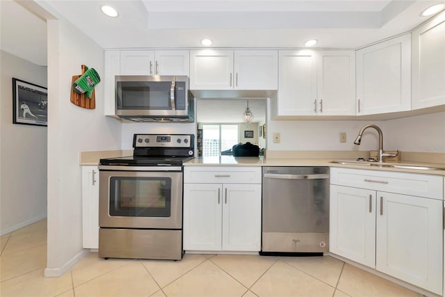 101 S Gulfstream Ave Unit 16C, Sarasota, FL 34236 - kitchen featuring appliances with stainless steel finishes, a sink, white cabinets, light countertops, and recessed lighting