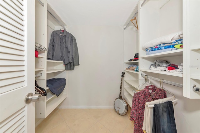 101 S Gulfstream Ave Unit 16C, Sarasota, FL 34236 - walk in closet featuring tile patterned floors