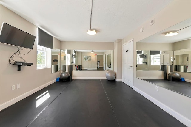 101 S Gulfstream Ave Unit 16C, Sarasota, FL 34236 - exercise area featuring baseboards and a textured ceiling