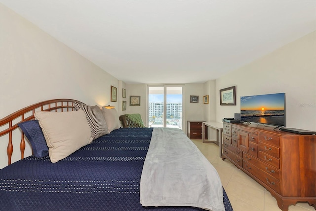 101 S Gulfstream Ave Unit 16C, Sarasota, FL 34236 - bedroom with access to exterior and light tile patterned flooring