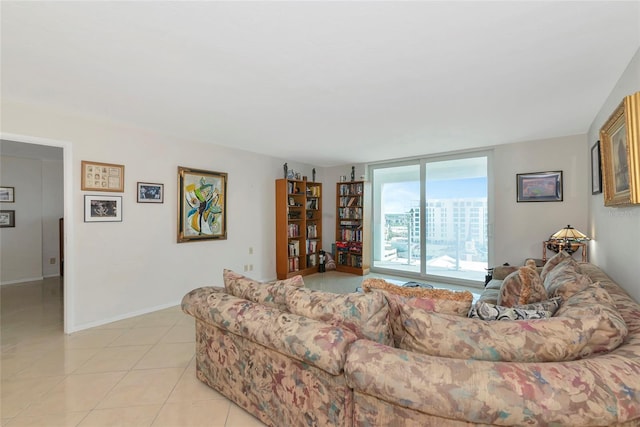 101 S Gulfstream Ave Unit 16C, Sarasota, FL 34236 - living area featuring light tile patterned flooring and baseboards
