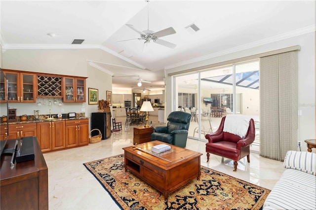 2067 Tocobaga Ln, Nokomis, FL 34275 - living room featuring wet bar, ceiling fan, crown molding, and lofted ceiling
