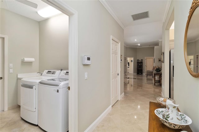 2067 Tocobaga Ln, Nokomis, FL 34275 - laundry area with separate washer and dryer, baseboards, and crown molding