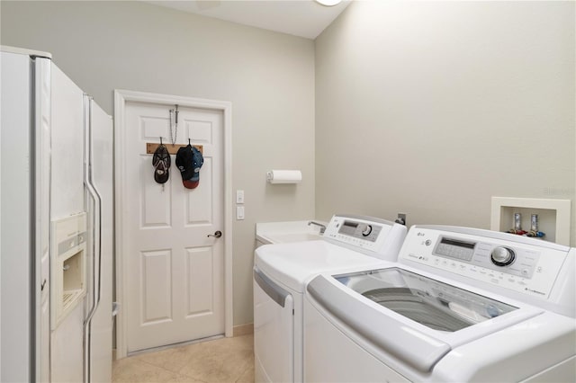 2067 Tocobaga Ln, Nokomis, FL 34275 - washroom with washing machine and dryer and light tile patterned floors