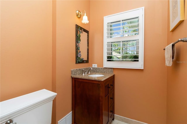 2067 Tocobaga Ln, Nokomis, FL 34275 - bathroom featuring vanity, toilet, and baseboards