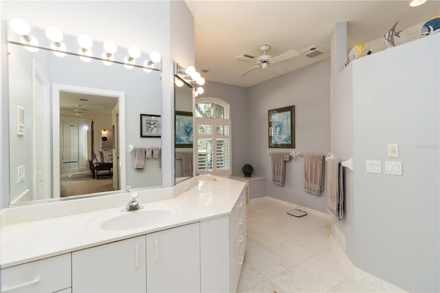 2067 Tocobaga Ln, Nokomis, FL 34275 - full bathroom featuring ceiling fan, vanity, tile patterned floors, and baseboards