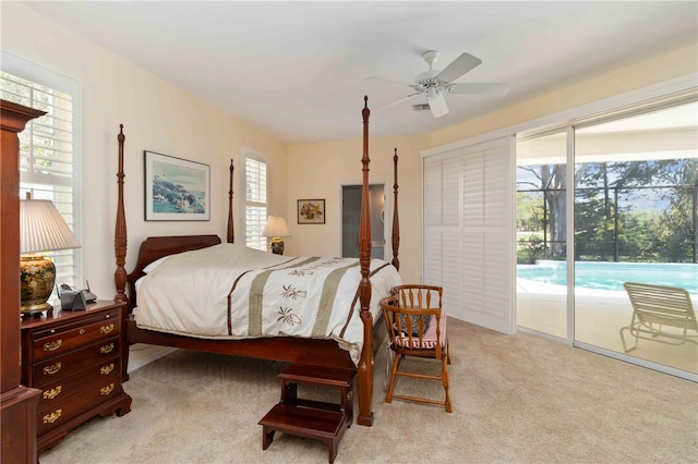 2067 Tocobaga Ln, Nokomis, FL 34275 - bedroom featuring access to outside, light colored carpet, and a ceiling fan