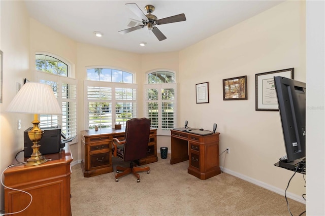 2067 Tocobaga Ln, Nokomis, FL 34275 - home office with light colored carpet, ceiling fan, and baseboards