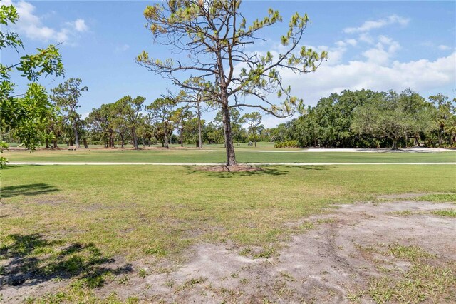 2067 Tocobaga Ln, Nokomis, FL 34275 - view of home's community featuring a lawn and view of wooded area