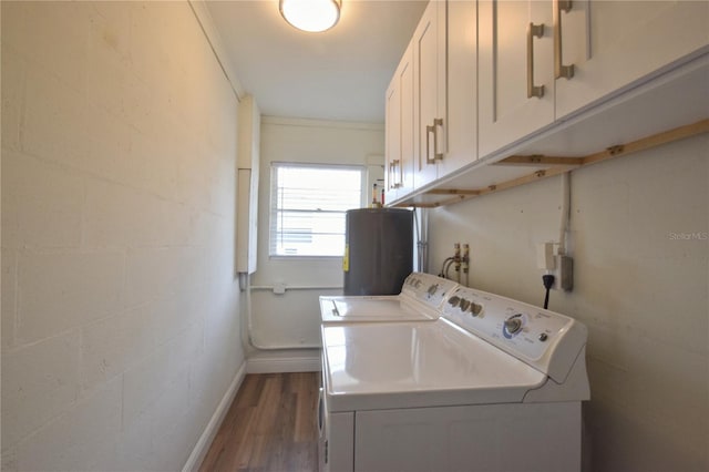 laundry room with washer and dryer, cabinet space, dark wood-style floors, baseboards, and water heater