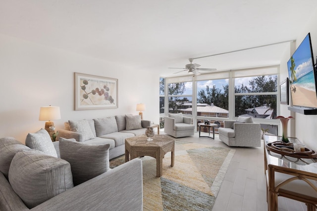 5200 Gulf Dr Unit 408, Holmes Beach, FL 34217 - living area with a ceiling fan and light wood finished floors