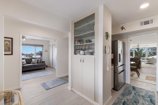 5200 Gulf Dr Unit 408, Holmes Beach, FL 34217 - hall with light wood finished floors and baseboards