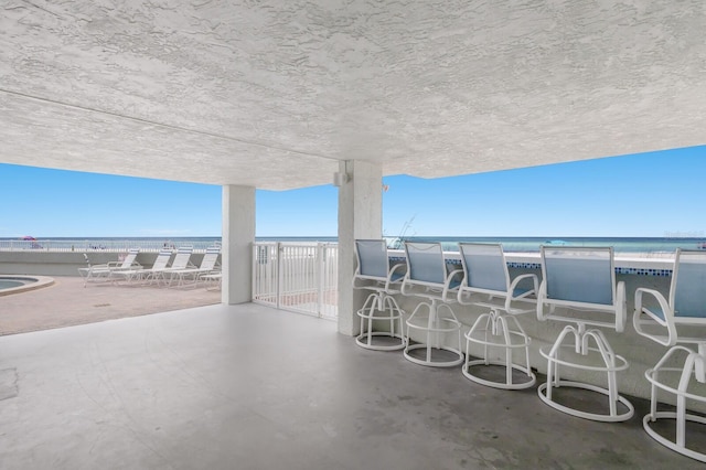 5200 Gulf Dr Unit 408, Holmes Beach, FL 34217 - view of patio / terrace featuring a water view and a balcony