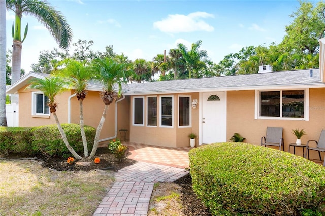 single story home featuring stucco siding