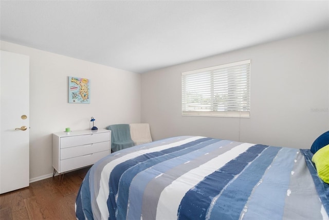 bedroom with wood finished floors