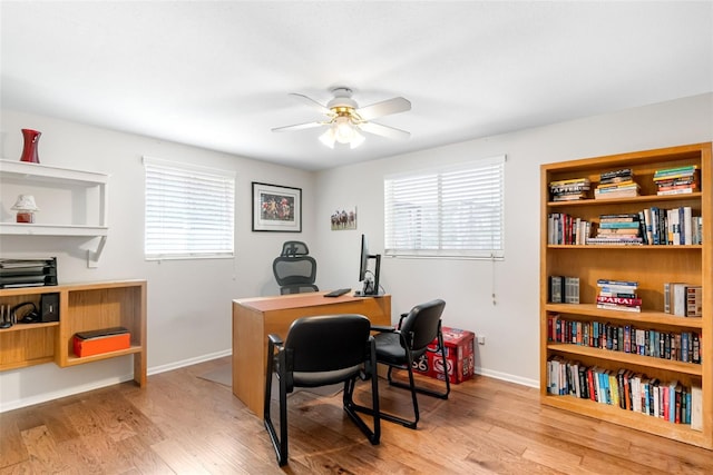 home office with ceiling fan, light wood-style flooring, and plenty of natural light
