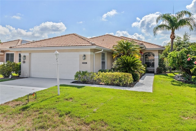 6764 Hickory Hammock Cir, Bradenton, FL 34202 - mediterranean / spanish-style home featuring a tile roof, a front lawn, a garage, stucco siding, and driveway