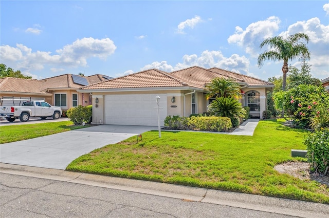 6764 Hickory Hammock Cir, Bradenton, FL 34202 - mediterranean / spanish-style home with a tile roof, a garage, a front lawn, driveway, and stucco siding
