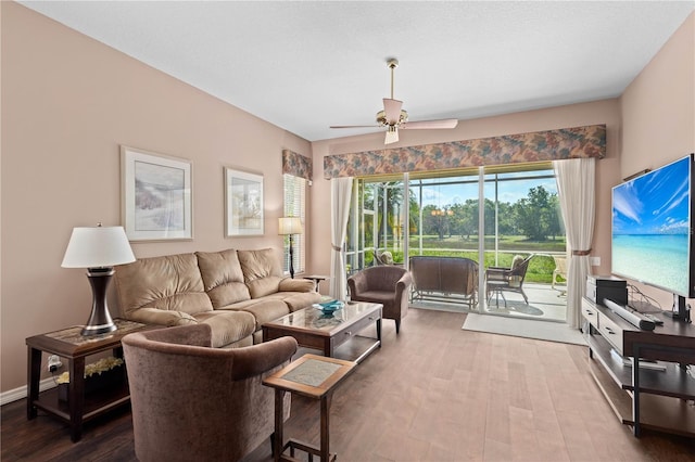 6764 Hickory Hammock Cir, Bradenton, FL 34202 - living room with a ceiling fan and wood finished floors
