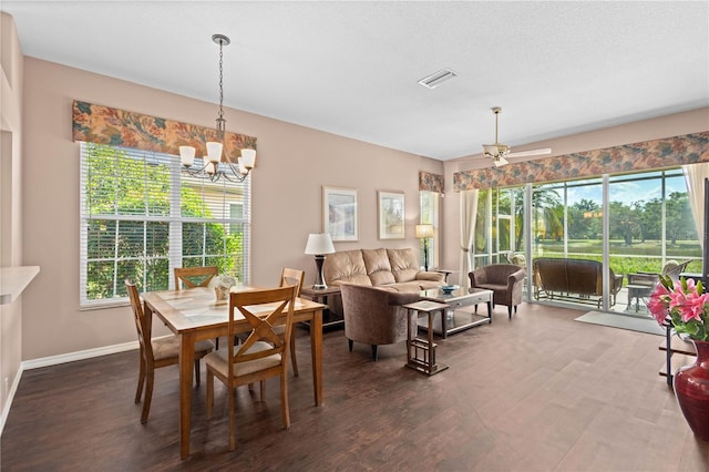 6764 Hickory Hammock Cir, Bradenton, FL 34202 - dining area featuring plenty of natural light, dark wood finished floors, a chandelier, and baseboards