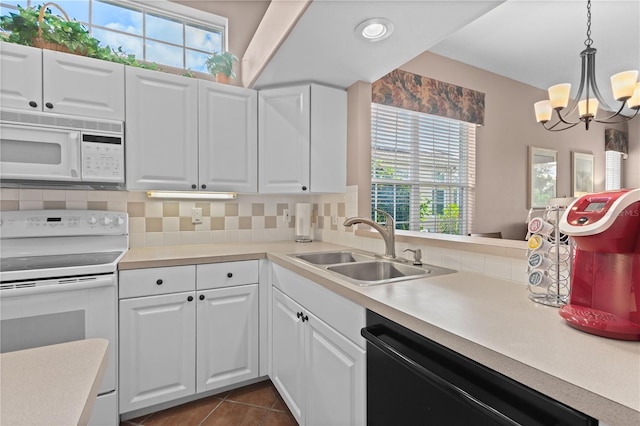 6764 Hickory Hammock Cir, Bradenton, FL 34202 - kitchen with white appliances, a sink, tasteful backsplash, and healthy amount of natural light