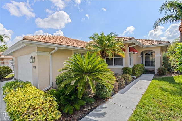 6764 Hickory Hammock Cir, Bradenton, FL 34202 - mediterranean / spanish-style house featuring a tiled roof, stucco siding, and a garage