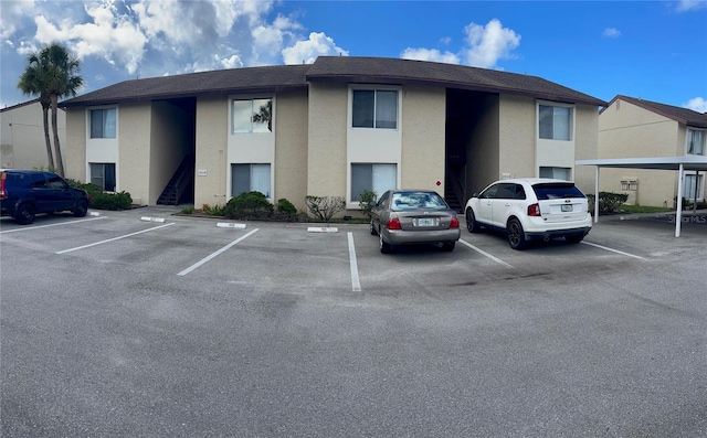 view of property with uncovered parking