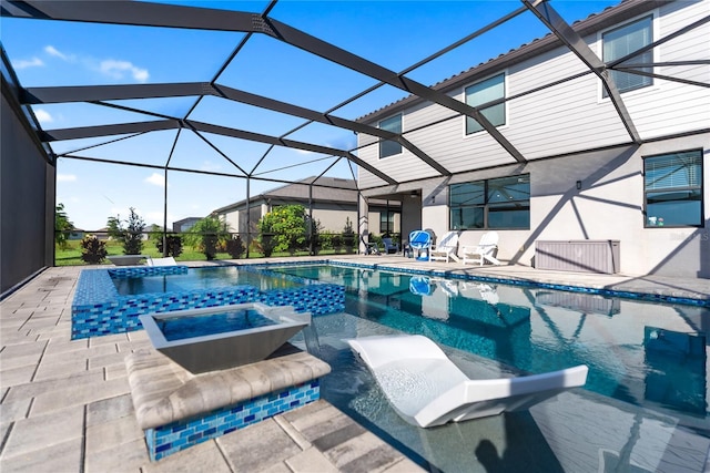 view of swimming pool featuring a patio, a pool with connected hot tub, and a lanai