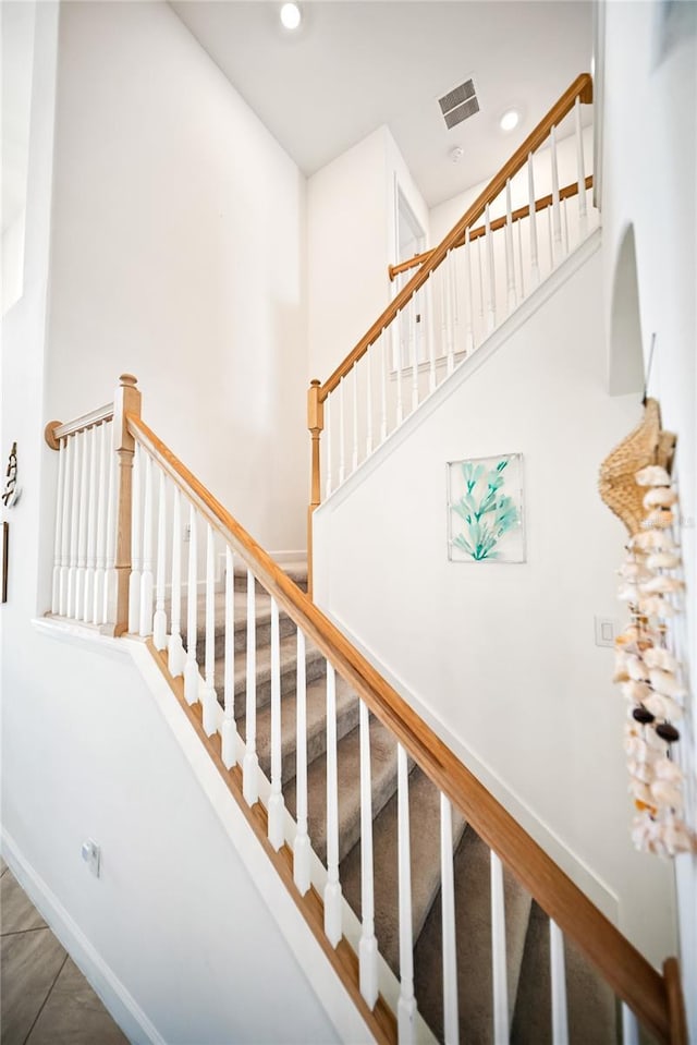 staircase with baseboards and recessed lighting
