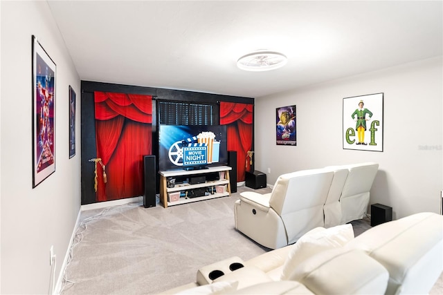cinema with carpet flooring and baseboards