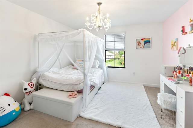 bedroom featuring light colored carpet, a chandelier, and baseboards