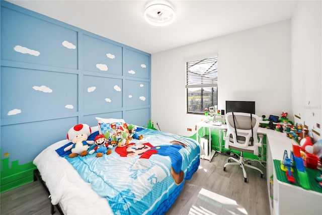 bedroom featuring wood finished floors