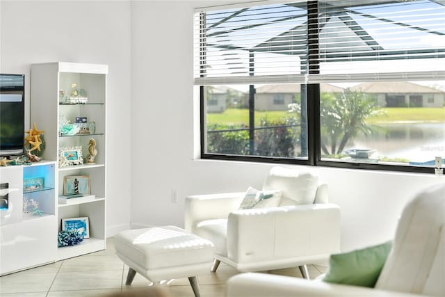 sitting room featuring healthy amount of natural light and tile patterned floors
