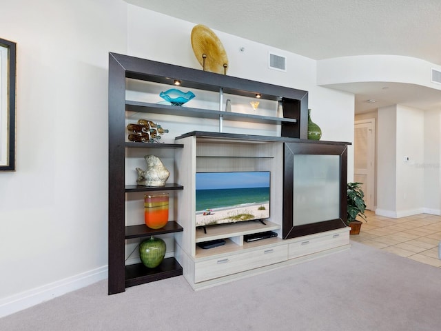 6512 Midnight Pass Rd Unit 303, Sarasota, FL 34242 - bar with baseboards, tile patterned floors, and carpet