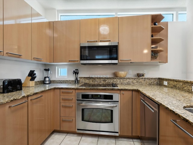 6512 Midnight Pass Rd Unit 303, Sarasota, FL 34242 - kitchen with stainless steel appliances, light stone countertops, open shelves, and light tile patterned floors