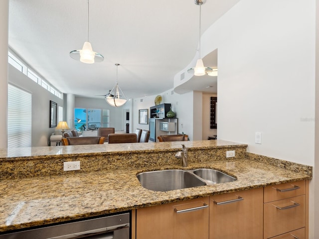 6512 Midnight Pass Rd Unit 303, Sarasota, FL 34242 - kitchen featuring a sink, light stone countertops, pendant lighting, and open floor plan