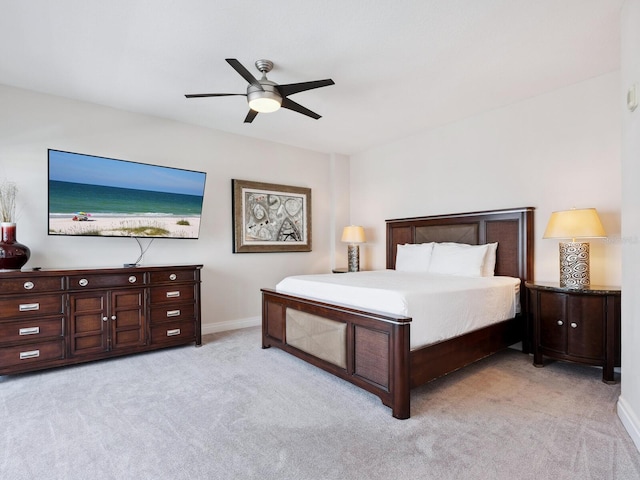 6512 Midnight Pass Rd Unit 303, Sarasota, FL 34242 - bedroom with light colored carpet, baseboards, and ceiling fan