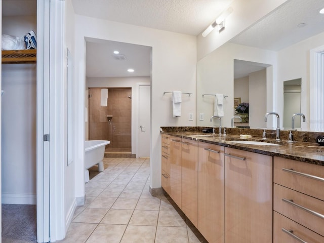 6512 Midnight Pass Rd Unit 303, Sarasota, FL 34242 - full bath with a stall shower, double vanity, a soaking tub, tile patterned flooring, and recessed lighting