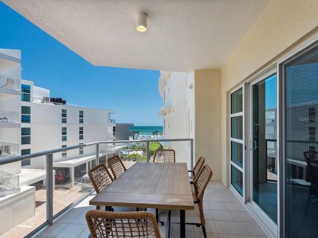 6512 Midnight Pass Rd Unit 303, Sarasota, FL 34242 - balcony with a water view and outdoor dining space
