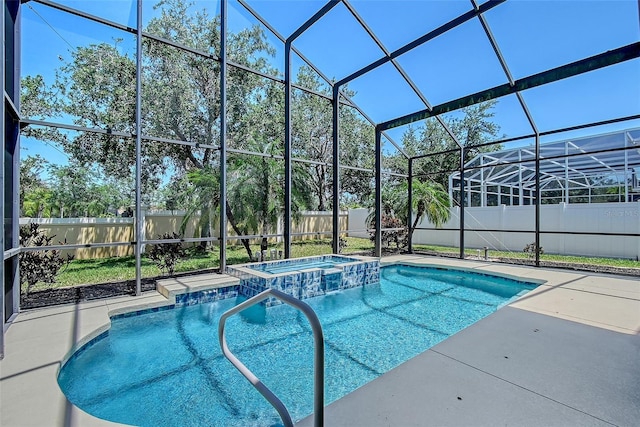 6605 38th Ln E, Sarasota, FL 34243 - view of swimming pool with a fenced backyard, glass enclosure, a patio, and a pool with connected hot tub